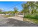 Gated estate entrance with brick driveway at 3704 Berger Rd, Lutz, FL 33548