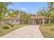 Grand two-story home with tile roof and covered entry at 3704 Berger Rd, Lutz, FL 33548