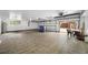 Large two-car garage with tiled flooring and plenty of storage space at 3704 Berger Rd, Lutz, FL 33548