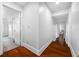 Bright hallway with hardwood floors and access to bedrooms at 3704 Berger Rd, Lutz, FL 33548