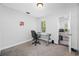 Home office with a desk, chair, and view of the backyard at 3704 Berger Rd, Lutz, FL 33548