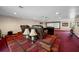 Home theater with comfortable seating and large projection screen, ready for movie night at 3704 Berger Rd, Lutz, FL 33548