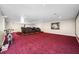 Home theater with comfortable reclining seats and exercise bike at 3704 Berger Rd, Lutz, FL 33548