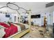 Main bedroom with king-size bed, large TV and walk-in closet at 3704 Berger Rd, Lutz, FL 33548