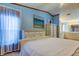 Spacious primary bedroom features natural light, plenty of storage, and access to the ensuite bathroom at 3841 Julie Dr, Wesley Chapel, FL 33543