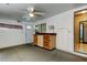 Versatile bonus room featuring a ceiling fan, storage, and natural light at 3841 Julie Dr, Wesley Chapel, FL 33543