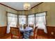 Cozy dining area with bright windows and seating for four at 3841 Julie Dr, Wesley Chapel, FL 33543