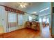 Open-concept living room with breakfast bar and dining area offers space for entertaining Gathering and friends at 3841 Julie Dr, Wesley Chapel, FL 33543
