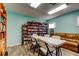 Inviting meeting room offers book shelves and comfortable seating perfect for gathering or reading at 3841 Julie Dr, Wesley Chapel, FL 33543