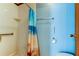 The tiled stand-up shower includes a convenient grab bar at 3841 Julie Dr, Wesley Chapel, FL 33543