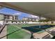 Community shuffleboard courts with shaded seating and well-maintained playing surface at 3841 Julie Dr, Wesley Chapel, FL 33543