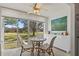 Bright dining area with glass doors leading to a garden view at 5095 Bay Ne St # 117, St Petersburg, FL 33703