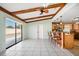 Living room with pool view and wood beam ceilings at 5117 Roanoke Dr, Holiday, FL 34690