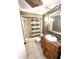 Updated bathroom with antique vanity and decorative shower curtain at 5265 E Bay Dr # 410, Clearwater, FL 33764