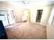 Carpeted bedroom with sliding doors to enclosed patio at 5265 E Bay Dr # 410, Clearwater, FL 33764