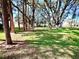Spacious grassy area with mature trees, perfect for relaxing at 5265 E Bay Dr # 410, Clearwater, FL 33764