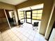 Enclosed patio with tiled floor and two folding chairs at 5265 E Bay Dr # 410, Clearwater, FL 33764