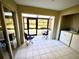 Laundry room with washer, dryer and enclosed patio access at 5265 E Bay Dr # 410, Clearwater, FL 33764