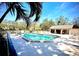 Community pool with surrounding patio and lounge chairs at 5265 E Bay Dr # 410, Clearwater, FL 33764