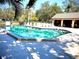 Community pool with patio and lounge chairs at 5265 E Bay Dr # 410, Clearwater, FL 33764
