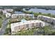 Aerial view of waterfront condo community with pool and lush landscaping at 6315 Shoreline Dr # 3208, St Petersburg, FL 33708