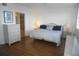 Bright bedroom featuring a king-size bed and ensuite bathroom at 6315 Shoreline Dr # 3208, St Petersburg, FL 33708