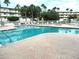 Inviting community pool with lounge chairs at 6315 Shoreline Dr # 3208, St Petersburg, FL 33708