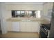 Kitchen with white cabinets, stainless steel appliances, and a breakfast bar at 6315 Shoreline Dr # 3208, St Petersburg, FL 33708