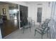 Screened lanai with seating and view of the living room at 6315 Shoreline Dr # 3208, St Petersburg, FL 33708