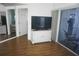 Living area with TV stand and balcony access at 6315 Shoreline Dr # 3208, St Petersburg, FL 33708