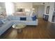 Spacious living room with sectional sofa and wood floors at 6315 Shoreline Dr # 3208, St Petersburg, FL 33708