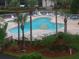 Relaxing kidney-shaped pool with surrounding patio at 6315 Shoreline Dr # 3208, St Petersburg, FL 33708