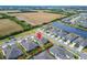 Beautiful aerial view of a well-planned community near a scenic lake and open green space at 6449 Mooring Line Cir, Apollo Beach, FL 33572