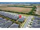 Picture of a well-maintained neighborhood surrounded by green fields at 6449 Mooring Line Cir, Apollo Beach, FL 33572