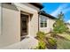 Inviting front entrance with a glass-paneled door, manicured landscaping, and a welcoming atmosphere at 6449 Mooring Line Cir, Apollo Beach, FL 33572