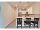 Modern kitchen featuring an island with bar seating, stainless steel appliances, and ample counter space at 6449 Mooring Line Cir, Apollo Beach, FL 33572