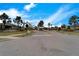 Street view of the Villas at Waterford community, featuring well-maintained landscaping and neighborhood signage at 6449 Mooring Line Cir, Apollo Beach, FL 33572