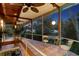 Open screened porch with tiled floor and outdoor seating at 711 Pinellas Point S Dr, St Petersburg, FL 33705