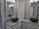 Modern bathroom with dual sinks, granite countertops, and updated vanity at 8222 Brent St, Port Richey, FL 34668