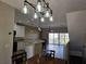 Open dining area with wood table and modern light fixture at 8222 Brent St, Port Richey, FL 34668