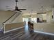 Open living area with kitchen island and hardwood floors at 8222 Brent St, Port Richey, FL 34668