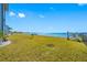 Spacious grassy backyard with a water view and access to the waterfront at 828 Bahia Del Sol Dr # 59/ A, Ruskin, FL 33570