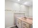 Bathroom with light wood cabinets and pink countertop at 828 Bahia Del Sol Dr # 59/ A, Ruskin, FL 33570