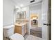 Bright bathroom with light wood cabinets and tiled floor at 828 Bahia Del Sol Dr # 59/ A, Ruskin, FL 33570