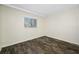 Simple bedroom with wood-look tile floors and a window at 828 Bahia Del Sol Dr # 59/ A, Ruskin, FL 33570