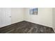 Bright bedroom with wood-look tile floors and a window at 828 Bahia Del Sol Dr # 59/ A, Ruskin, FL 33570