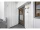 Exterior entryway with dark brown door and white building exterior at 828 Bahia Del Sol Dr # 59/ A, Ruskin, FL 33570