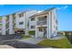 Condo building's front view with parking area at 828 Bahia Del Sol Dr # 59/ A, Ruskin, FL 33570