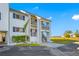 Condo building's side entrance with parking at 828 Bahia Del Sol Dr # 59/ A, Ruskin, FL 33570