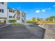 Condo building's front entrance with parking at 828 Bahia Del Sol Dr # 59/ A, Ruskin, FL 33570